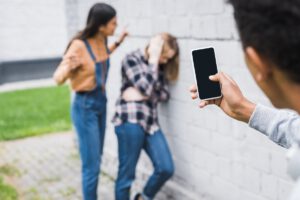 Selective Focus Of African American Boy Shooting Bulling Of Scared Teenager